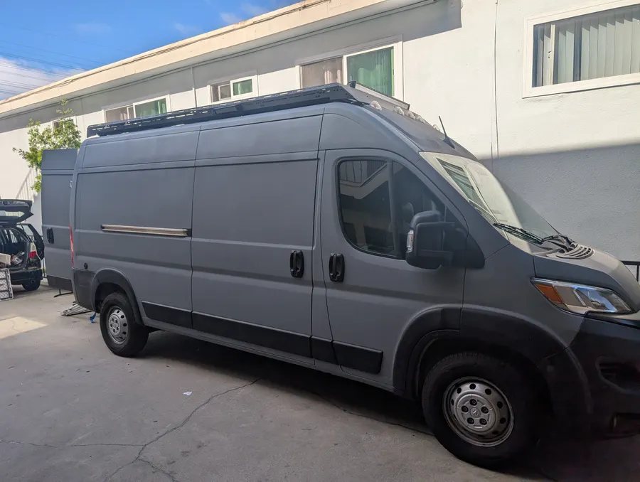 Bedliner-coated ProMaster with roof rack and light bar — Big Bear Camper Vans build
