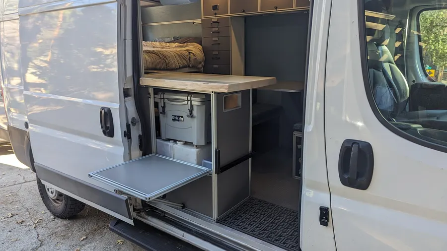 Slide-out galley platform with cooler and water storage — Big Bear Camper Vans build
